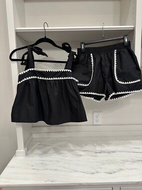 Pink Lily small Black Two-Piece Tie-Shoulder Top & Shorts Set with White Trim.